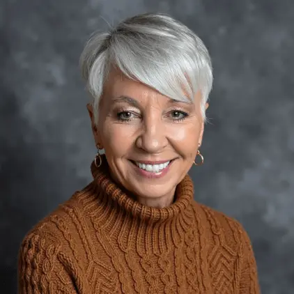 Tammy Dahl author portrait with a warm smiling expression in a professional headshot featuring a light gray background.